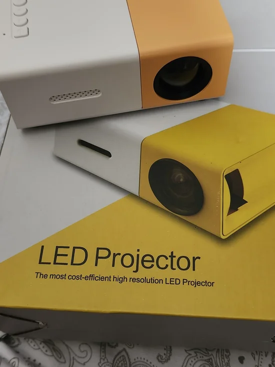 Compact White and Yellow Mini Projector with Remote - Picture 4 of 5